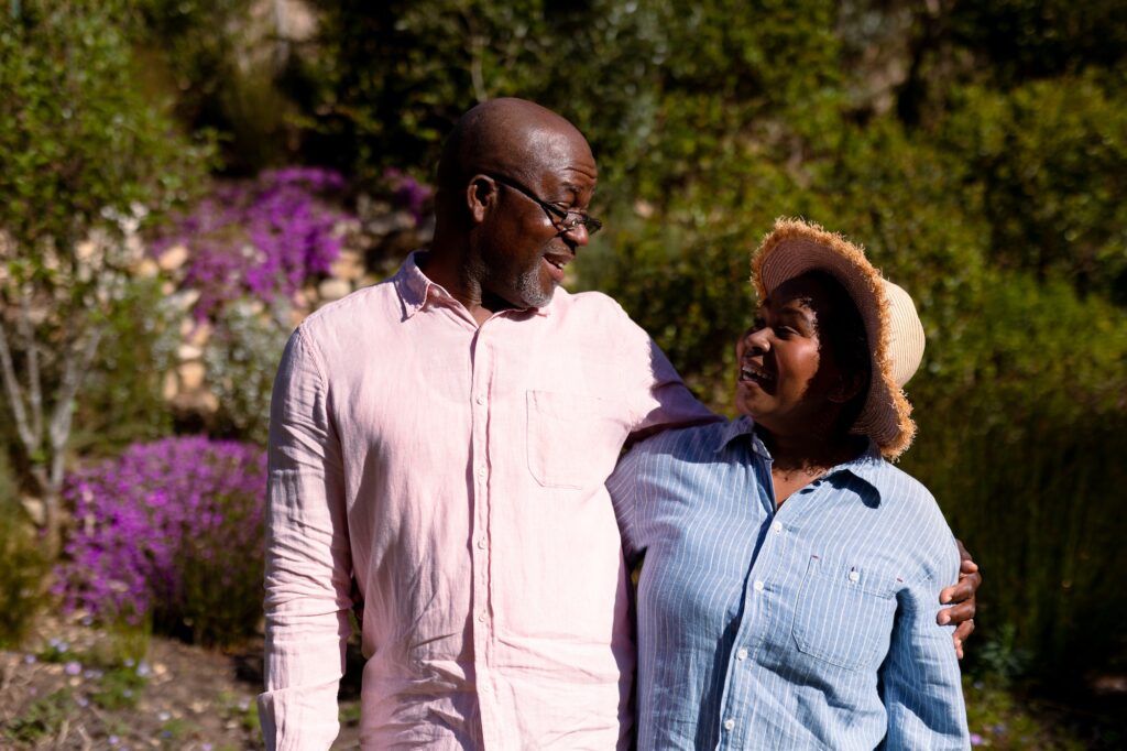 Happy african american senior couple embracing outdoors